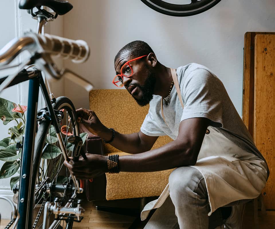 man working on bikes
